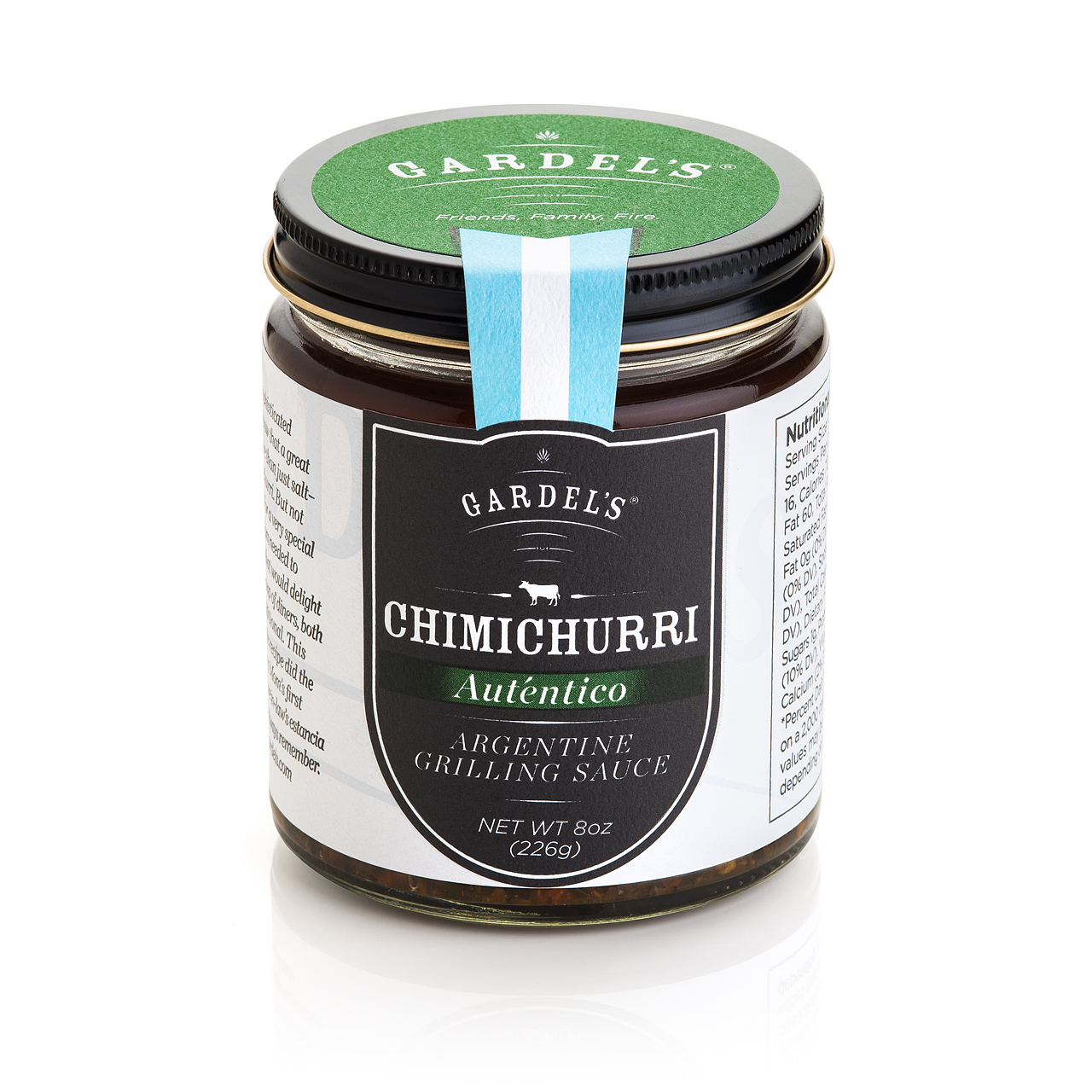 Jar of Gardel's Auténtico chimichurri sauce with fresh parsley and garlic